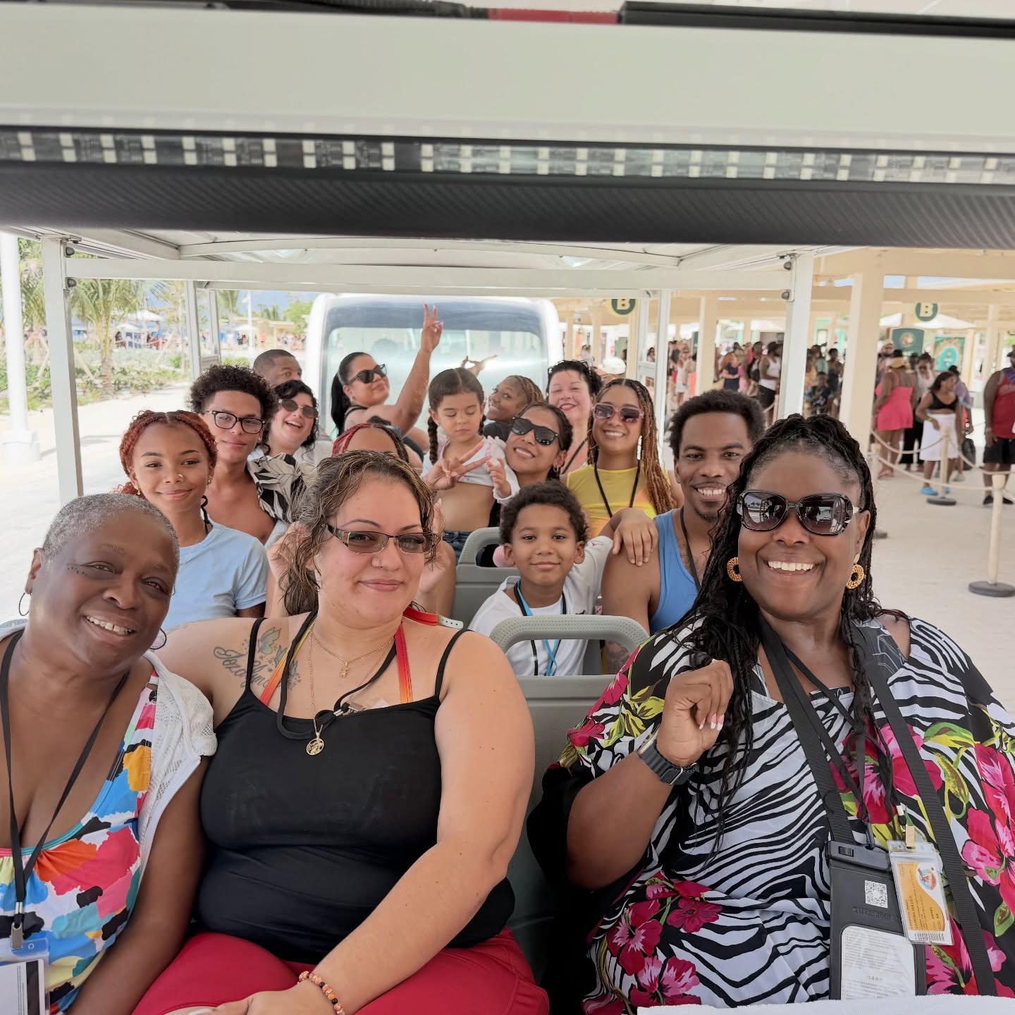 A happy group of travelers on a tram during a cruise shore day
